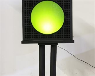 112	Art Nouveau Green Glass Wall Light Stand	"Art Nouveau green glass wall light stand. 20th Century. Black painted stand supporting a green glass light, with two Art Nouveau female nude bookends flanking a smaller green glass piece on top. Lighting has been tested and works. Some small wear and scuffing to base and left side. 

58"" H x 27"" L x 9"" D
"
