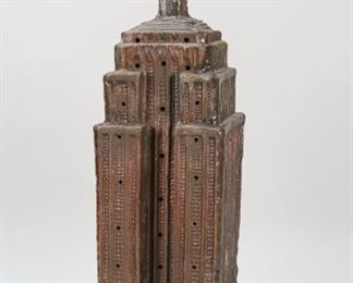 117	Iron Empire State Building Table Lamp	Painted iron Empire State Building lamp with King Kong finial. 7"L x 7" W x 23 1/2" H. Repair to the spire.
