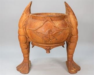 119	Patinated Cast Iron Shrimp Planter	Patinated cast iron shrimp planter. 19" L x 7 1/2" W x 20 1/4" H. Opening: 9 1/2" diameter. Rust present, crazing to the surface, repair to the left shrimp tail.
