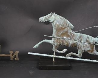 124	Copper Horse and Jockey Weathervane	"Copper horse and jockey weathervane with directional. 
Horse feet are separated from base. Directional is missing top finial. Stand not included. 
Weathervane: 16 1/2"" x 32"" with out directional. 
"
