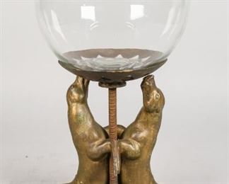 151	After Louis Albert Carvin Art Deco Seal Planter	After Louis Albert Carvin (French, 1875-1951) painted metal seals mounted on a hardstone base. Modified from lamp. Metal stand with glass fishbowl planter. Metal stand inscribed illegibly on the rim. 8" L x 5" W x 14 1/2" H (from base to top of fishbowl planter). Later paint application to seals and metal stand. Wear to paint on seal's body.
