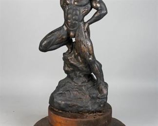 161	Faux Bronze of a Strongman	"Faux bronze of a strongman. 20th Century. A sideshow strongman or Olympian flexing his muscles. Plaster, bronzing patina, and wire frame standing on graduated wooden base. Appears unsigned. Lines evident from cracking directly below and around the waist and left thigh, which was previously repaired. 

"

