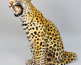 178	Italian Glazed Pottery Leopard	Italian glazed pottery leopard. Marked in the interior Made in Italy. 13" L x 7" W x19 1/4" H. Crazing to glaze throughout body, hole to neck.
