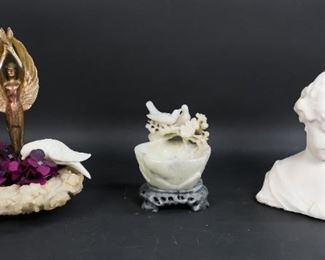 181	Marble Bust & 2 Hardstone Sculptures	"Young girl marble bust, hardstone wreath of flowers with later added patinated metal angel, hardstone dove and acrylic flowers. Hardstone carved bowl with birds. Hardstone wreath with patinated metal angel: 10"" H x 7"" diameter. Chips, scuffing and discoloration to the hardstone wreath of flowers. Wear to patina on metal angel. Loss to interior of the hardstone wreath. Scuffs, discoloration to the marble bust. Pitting and scratches to the hardstone bowl. Marble bust unsigned. Metal angel statue and bird are loose in the wreath of flowers.
"
