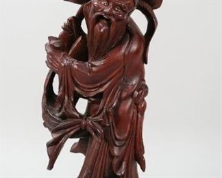 186	Carved Chinese Wooden Figure	"Chinese wooden figure of man.
23 1/2"" H x 6 1/2"" Base diameter."
