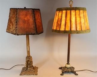 183	2 Metal Table Lamps with Mica Shades	"2 figural painted metal table lamps with mica shades. Lamp with lion's paw base: 22 1/2"" H. 
Wear, crazing to the shades. Wear to paint on 1 stand. Repair to the interior of 1 shade."
