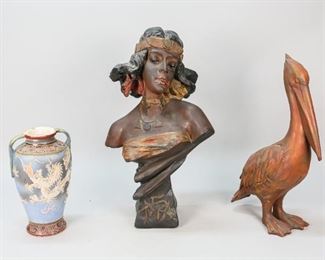 188	3 Pottery Items	Japanese pottery vase with raised dragon decoration. Plaster polychrome painted orientalist bust. Signed illegibly in cartouche on verso. Plaster painted pelican. Bust: 18 1/2" H. Discoloration to dragon pottery vase, loss to paint. Crazing to surface of raised decoration. Pitting to shoulders of bust, paint discoloration to the face. Later painting to the pelican.
