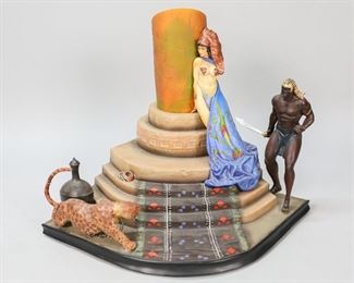 189	After Frank Frazetta ReelArt Egyptian Queen Statue	After Frank Frazetta (American, New York, 1928-2010). Egyptian Queen composition statue by ReelArt Studios. Sculpted by Gabriel Marquez and painted by Alex Castro. With info on the underside and numbered 3/2000. 12"H x 16"W x 13 1/2"D. Figure on right side partially detached, scratch along back side.
