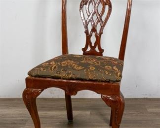 224	George III Chippendale Style Chair	"George III Chippendale Style chair. Early 20th Century. Ball-and-claw feet with acanthus mounts, heavily carved  splat with foliage motifs, upholstered seat cushion. Some slight loss to feet, some loss to left side of chair. Wormholing present above cushion chassis.

41"" H x 21 1/2"" L x 18"" W"

