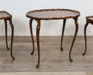 234	Queen Anne Style Marquetry Inlaid Nesting Tables	"Queen Anne style marquetry inlaid nesting tables. Early 20th Century. Trio of nesting tables with pad feet cabriole legs, and floral marquetry inlays. Fading to largest table, leg block on underside previously repaired.

Largest table measures 22 1/2"" H x 25"" L x 18"" W
"
