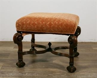 238	William and Mary Upholstered Footstool	"William and Mary upholstered footstool. Potentially Flemish, 18th/19th Centuries. Carved walnut with ornate cross stretcher, red and yellow upholstery applied with tacking. Wear and loss to feet, loss to top of finial on stretcher. 

17"" H x 19"" L x 17"" W"
