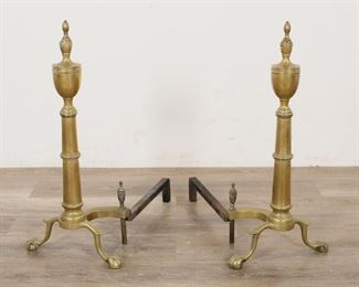 239	Pair of Chippendale Brass Andirons	"Pair of Chippendale style brass andirons. American, 19th Century Steepletop form tops, ball-and-claw feet. Some rust and wear to both.

23"" H x 11"" L x 18"" W"
