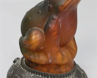 242	Iridescent Frog Table Lamp	"Table lamp with frog form iridescent glass shade. 
Slight chip to base of frog shade. 
6 1/2"" H x 4 3/4"" L"
