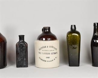 244	6 American Brown Glass Bottles & Jug	"5 American brown glass bottles and pottery jug marked ""Haynes & Company Pure Flavoring Extracts. 1 bottle marked "" Father John's Medicine. Lowell Mass."" 
Tallest bottle: 11 1/2"" H."