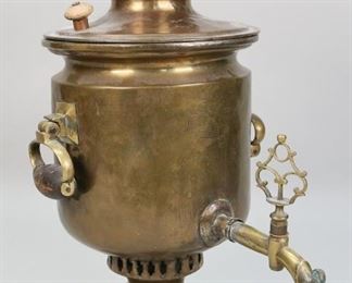 246	Russian Brass Samovar	"Russian Brass Samovar. Circa late 19th century. 3 dushnick missing, indentation to the body, cover detached from piece, indentation to the rim. Crane is loose from piece. 4 1/4"" L x 4 1/4"" W x 16"" H.
"