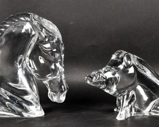        255	2 Baccarat Crystal Figurines Tauni De Lesseps	"2 Baccarat glass figurines, horse and wild boar. Baccarat stamped on base on both. 
Horse signed ""Baccarat Tauni de Lesseps"".

Boar has chip to back and on 1 hoof. 

Horse: 6 1/2"" H x 5"" L.
Warthog: 4"" H x 6"" L."
