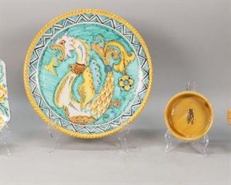        257	4 Majolica Dishes	4 Majolica dishes. A handled dish, a rectangular vegetable dish, an ashtray and a platter. Decorated with blue and yellow glaze, flowers. 1 platter featuring a dragon. Platter: 12 1/2" Diameter.