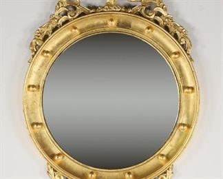        287	Federal Style Eagle Gilded Bullseye Mirror	"Federal style eagle gilded bullseye mirror,
19th/20th Century.

29"" x 19""."