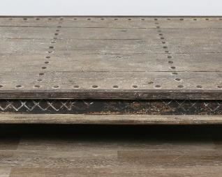        290	Industrial Cocktail Table	"Industrial cocktail table. Late 20th Century. Cast iron, repurposed planks and rivets, carved block legs with bun feet. Slight wear to feet, scratches to one corner of top. 

14 1/2"" H x 72"" L x 48"" W"