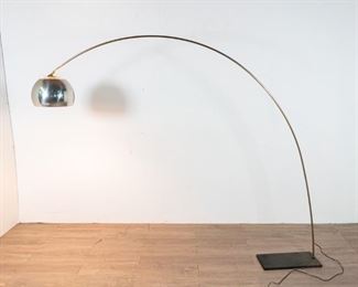        293	Arc Floor Lamp in the Manner of Goffredo Reggiani	"Arc floor lamp in the manner of Goffredo Reggiani (Italian, 1929- present.) Stainless steel shade and arcing support, chrome grating on shade, granite base. Lamp has been tested and is in working order. Some blemishes and scuffs to shade, tarnishing along arcing post. 

65"" H x 18"" L x 9"" D at base. Approximately 71""L from base to shade."