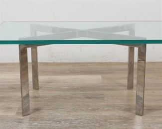        299	Mies Van Der Rohe Style Barcelona Cocktail Table	"Ludwig Mies van der Rohe (German, 1886-1969), Barcelona style cocktail table designed for Knoll Industries. 20th Century. Thick beveled green tinted glass top, bar stock steel base with buffed chrome finish. Wear and scuffing throughout base, small scratches to top. Heavy fleabites and loss to one end of top.  

16"" H x 37"" L x 20"" W"