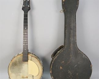        301	Gibson Small Tenor Banjo	"Gibson small tenor banjo. American, Early 20th Century.  Original Gibson Mandolin-Guitar Company label on inside of resonator, serial number on dowel stick states 11715-17. Major wear throughout banjo on resonator, drum head and neck. Strings loose, wear to headstock. Significant wear to fitted case. 

In fitted case: 30"" H x 13"" L x 5"" W"