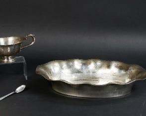        308	6 Silver Items	"835 German silver bowl, makers mark HKJ in circle. 850 Mexican souvenir spoon. Danish sterling souvenir spoon. Preisner sterling teacup and saucer. 800 silver Israel openwork dish. 
Sterling teacup, saucer and Danish spoon: 236.2 grams.
800 openwork dish: 120.0 grams.
835 bowl: 259.0 grams.
850 Mexican spoon: 7.6 grams."