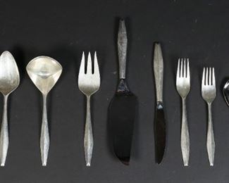        309	54 Pieces Reed & Barton Diamond Sterling Flatware	"54 pieces Gio Ponti (1891-1979) for Reed & Barton Diamond pattern flatware. 13 sterling handled knives, 1 sterling handled cake server, 12 forks, 11 salad forks, 24 tea spoons, 1 ladle, 1 sugar spoon, 1 meat fork, 1 serving spoon, 2 stainless steel sugar spoons. 
2,576 grams total not including knives."