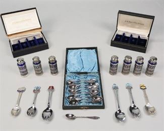        312	Grouping of 24 Silverplate Items	"7 F.B. Rogers cobalt glass salts with silverplate overlay, in fitted cases, 1 with lid detached from box. 11 demitasse spoons in lined case. 6 English souvenir spoons. 
Teapot: 13""H."