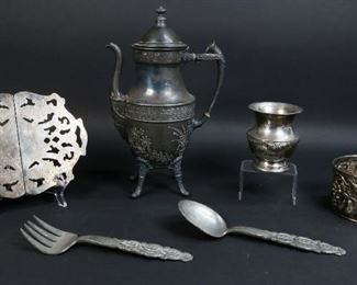        317	4 Silverplate Items, 2 Norwegian Pewter Utensils	"EL Delberti Italy repousse silverplate bowl with grapes and pears. James M Shaw & Co New York footed coffee pot. Sheridan vase. Crescent trivet. David Andersen Stopt Tinn pewter salad utensils. 
Scuffing to salad utensils and body of coffee pot.
Coffee pot: 12 1/2"" H.
"
