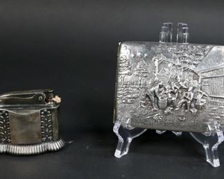        318	Ronson Diana Lighter & Silverplate Cigarette Case	"Ronson, Newark New Jersey lighter, ""Diana"".  Danish repousse silverplate cigarette case with genre scene, marked on the clip. 
Case: 3 1/4"" x 4""."