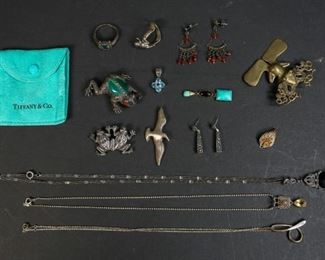        319	Grouping of Sterling Jewelry, 14k Gold Pendant	"3 necklaces featuring  Elsa Peretti for Tiffany & Co. alphabet letter pendant, letter D. 3 frog brooches, 2 pairs of earrings, 2 rings, 1 size 10. 2 pendants and 1 earring with turquoise stone. 96.2 grams total including stones. Each marked 925 or Sterling. 1 14k gold pendant marked .585 on verso.
Elsa Peretti necklace: 9 1/2"" length.
14k Gold Pendant: 1.6 grams. Elsa Peretti necklace marked 925 on clasp, signed on pendant, with Tiffany & Co pouch. 
"