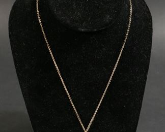        320	14k Gold Pendant & 12k Gold Chain	"14k gold heart pendant, marked on the interior and clasp. 12k gold chain, marked on the clasp. Pendant: 3.8 grams. Chain: 2.6 grams.
Chain: 8 1/2"" L."