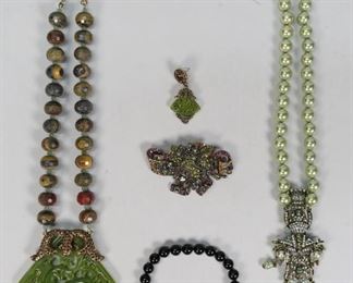        322	Collection of Heidi Daus Jewelry	"2 necklaces, 1 bracelet, 1 brooch and 1 earring. Faux pearl and glass beads, bejeweled pendants. Necklace: 13 3/4"" L. Bracelet: 9"" L x 3"" diameter. 
"