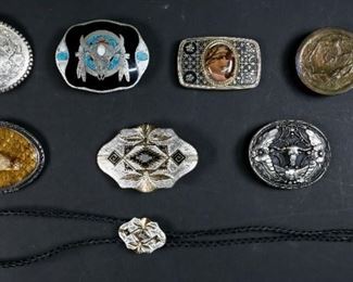        324	7 Western Belt Buckles	"7 Western belt buckles: 2 marked SSI, 2 marked Montana Silversmiths, 1 marked Johnson & Held Ltd. Denver Colorado, 1 marked with cameo, Napoleon Empereur. 1 is unmarked. 1 belt buckle with matching bolo tie. 
Diamondhead Rattlesnake buckle: 4"" L."