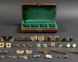        325	Collection of Cufflinks and Leather Case	"Monogrammed Buxton case with 5 compartment green velvet interior. 6 tie clips, 12 pairs of cufflinks, 2 separate cufflinks, and 4 pins. Designers include: Swank, Chenet and Hickok. 
Case: 7 1/4"" x 4 1/4"" x 1 1/2"" H."