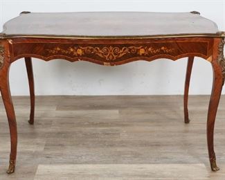        350	RJ Horner Louis XV Style Bureau Plat	"RJ Horner Louis XV style bureau plat. American/French, Late 19th/Early 20th Century. Walnut, inlaid marquetry flowers and foliate designs, raised on cabriole legs terminating in foliate bronze mounts. Bronze leg mounts and gallery. Remants of furniture label on bottom of drawer reads ""IMPORTED FROM PARIS BY RJ HORNER."" Loss to veneer on drawer front, cracquelure on top of piece. Top leg mounts are slightly loose.

30"" H x 45"" L x 28"" W

"