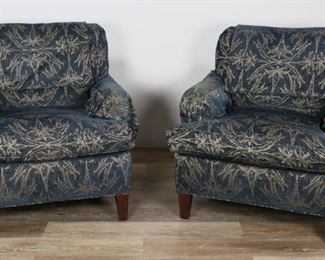        353	Pair of Howard Style Upholstered Armchairs	"Pair of Howard style upholstered armchairs. 20th Century. Dark blue with floral motifs, slip covers for back cushion and arm rests, mahogany feet, down cushions.  Some light wear to cushioning and feet. 

32"" H x 32"" L x 34"" W"
