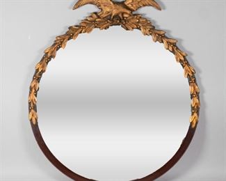        364	Federal Style Mirror	"Federal style mirror, dark wood frame with gilt wood eagle and leaves. Lines to both wings of eagle.
29 1/4"" H x 25 1/2"" Diameter."