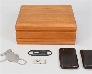        375	Credo Cigar Humidor	"Credo cigar humidor with 2 cigar holders, and 3 cigar cutters.

4 1/2"" H x 11"" L x 8 3/4"" W."