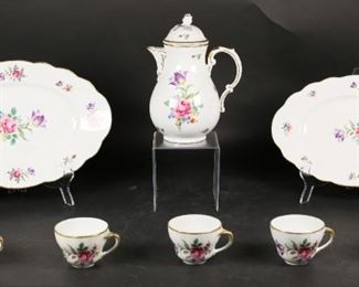        379	8 Pieces Winterling Bavaria Porcelain Dinnerware	"8 pieces Winterling Bavaria porcelain dinnerware. 1 coffee pot with lid, 5 tea cups, 2 platters. Each marked on the underside. Circa 1918. Wear to flowers on largest platter, center. Wear to gilt on rim on most pieces.
Largest platter: 15"" L x 9 3/4"" W. 
Coffee pot: 9 1/2"" H."