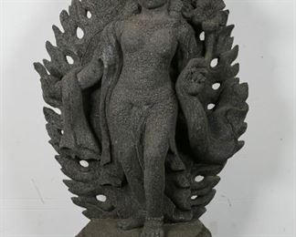        388	Javanese Volcanic Rock Deity Sculpture	"Javanese volcanic rock deity sculpture. Java, 21st Century. Volcanic rock carved into a stele form of a (most likely) Hindu deity, resting on top of a granite base. Right hand of deity previously repaired. Some wear to base.

Sculpture: 31 1/2"" H x 19 1/2"" L x 9"" D
Base: 4"" H x 20"" L x 14"" D"