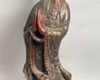        390	Carved Korean Buddha Sculpture	"Carved Korean Buddha sculpture. Korean, late 19th to early 20th century. Carved wooden sculpture of a female Buddha (possibly Tara) solemnly standing with hands in prayer, painted with red and gilt paint. Cracks on bottom center, loss to headpiece and robes on right hand side. 

34"" H x 10"" L x 9"" D"