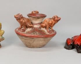        422	5 Pieces Frog Ceramics and Pottery	"5 pieces of frog ceramics: Mexican vase, label to underside. Ceramic seated frog with mandolin. Nicaraguan bowl signed on the underside. Pottery frog with drip glaze. Carved hardstone frog on rock, glass eyes. Inscribed BG on the underside with paper label. 
Frog with mandolin: 5 1/8"" H.
Contemporary Mexican frog vase: 7"" H. 
Scuffs to spout of the vase."