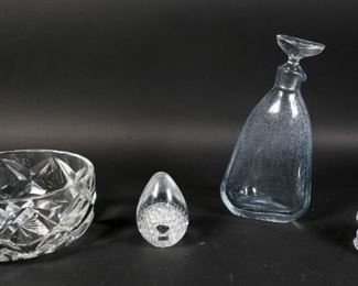        425	Crystal Bowl, Decanter and 2 Paperweights	"St. Louis France serving bowl. Etch marked on the underside. Baccarat Iceberg paper weight. Etch marked to the underside. FM Konstglas Konneby Sweden paperweight. Etch signed on the underside. Paper label to the front. Ovoid shaped crystal decanter. Decanter: 9 1/4"" H. Bowl: 7 5/8"" diameter x 3 1/2"" H. Chip to Baccarat paperweight. Clouding to the interior of decanter. Flake to the rim of St. Louis bowl.
"
