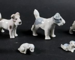        429	8 German Porcelain Dogs	"8 German porcelain terrier dog figurines. 3 marked on the paw, Germany. 1 figure: 3 H"" x 3 3/4"" L.
Small spaniel figure missing both rear legs.
"
