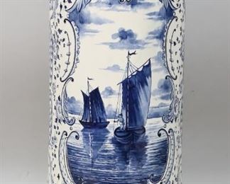        440	Royal Bonn Delft Porcelain Vase	German Royal Bonn Delft style porcelain vase. Decorated with scrolled floral borders and landscapes. Marked on the underside, form number 4295/J and impressed circle mark. Mark circa 1890-1920. 23 1/2" H x 11" top diameter. Repair to rim, chip to rim, crazing to the piece throughout.