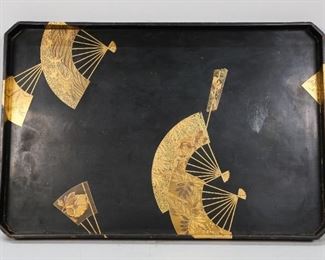        442	Japanese Lacquer Tray	Japanese maki-e lacquer tray. Decorated with fans, birds and plants. Circa Meiji Period. 15 1/2" L x 10 1/4" W x 1" H. Wear to the corners and edges of the tray. Scuffing to the surface on both the top and bottom.