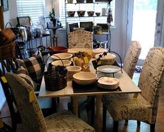 Kitchen trestle table with upholstered chairs and wood bench with pillows 