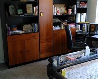 Loft study with four part wall storage shelf/unit (sold separately or all together), decorations including art work and books to spruce up your abode.